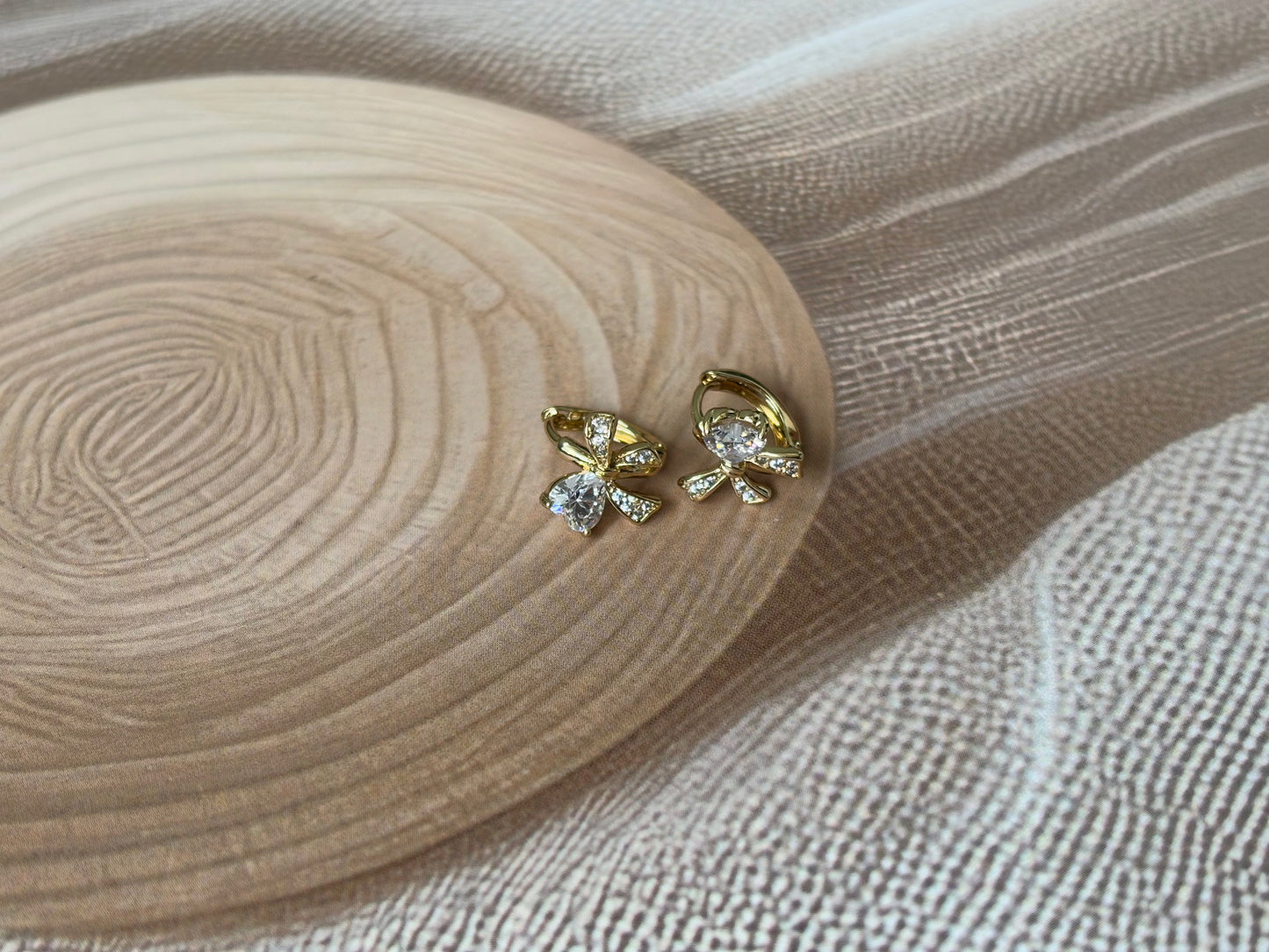 Bow huggie earrings