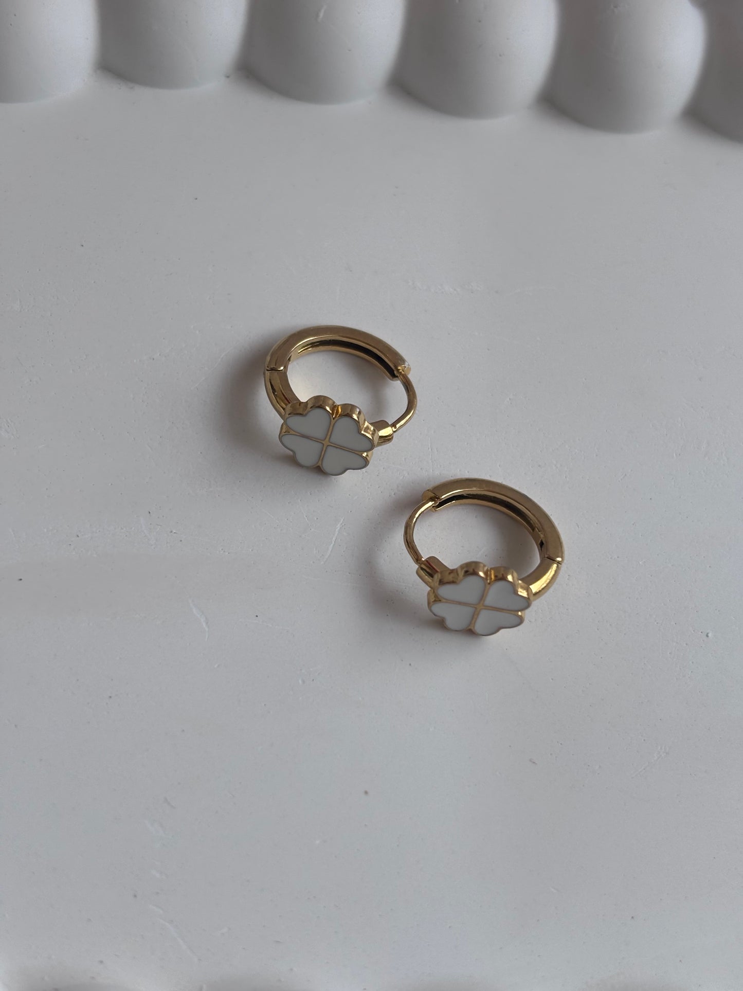 Clovery White Huggie Earrings
