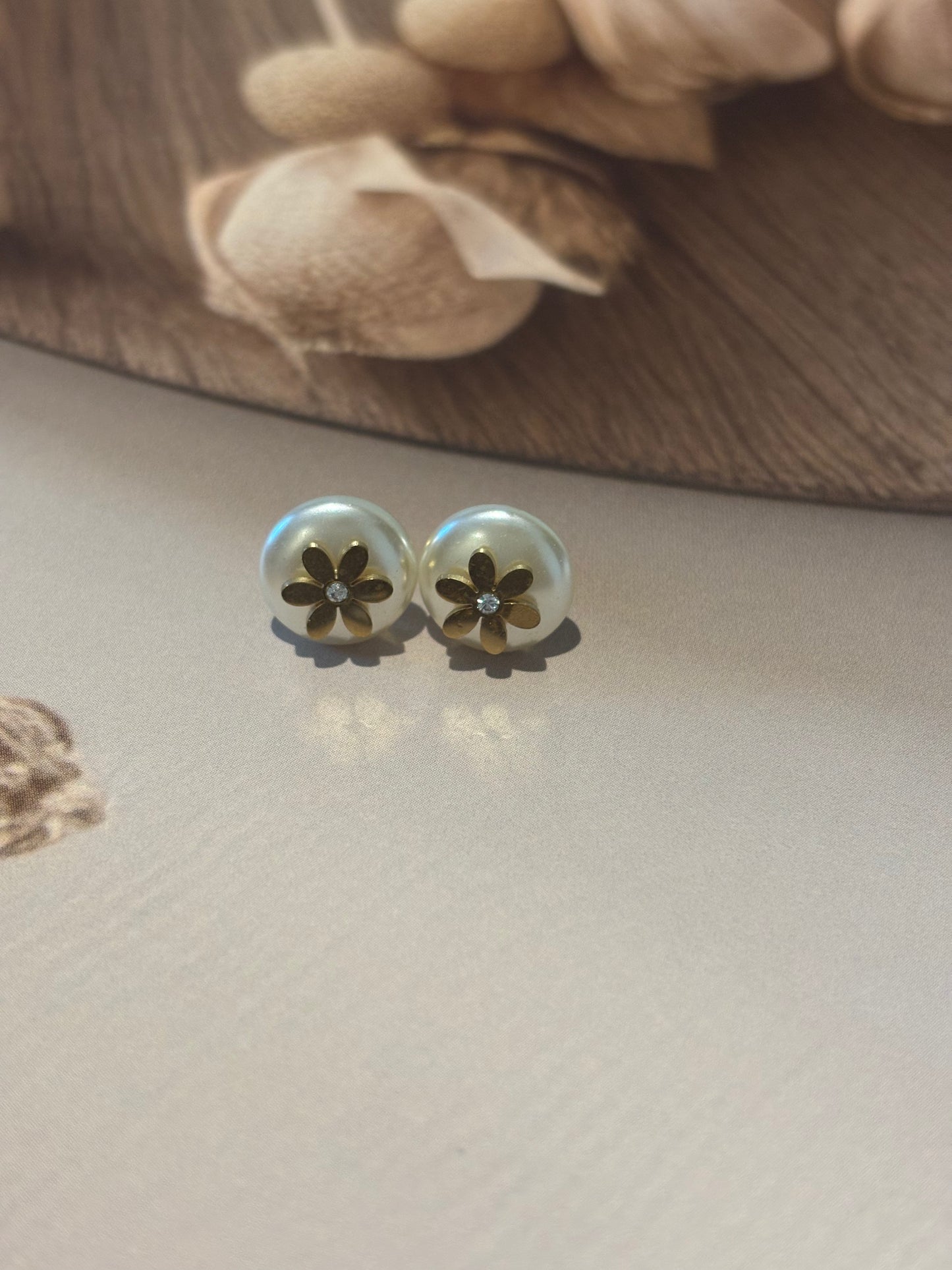 White stud with flower