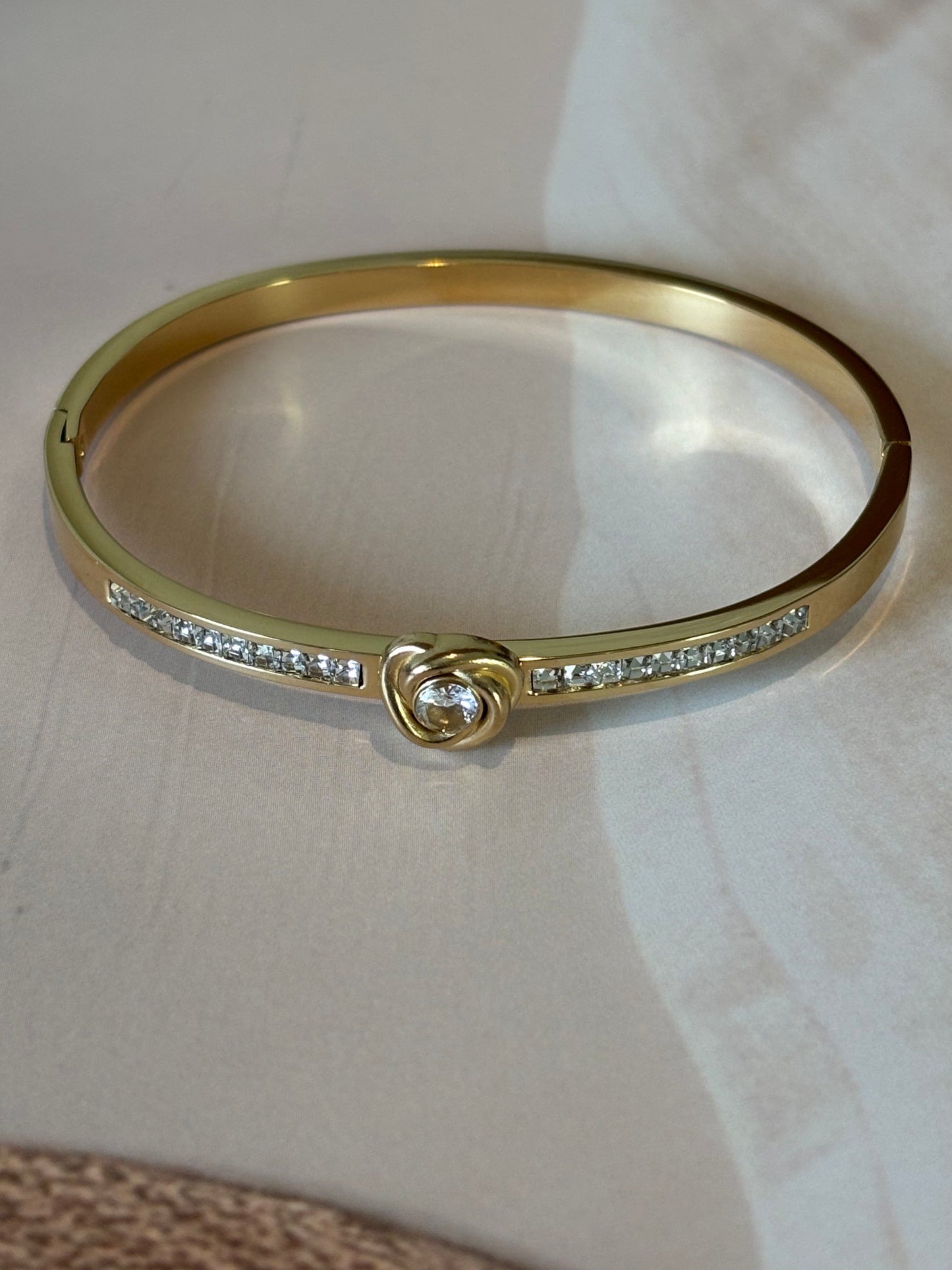 Golden white heart shape bracelet.