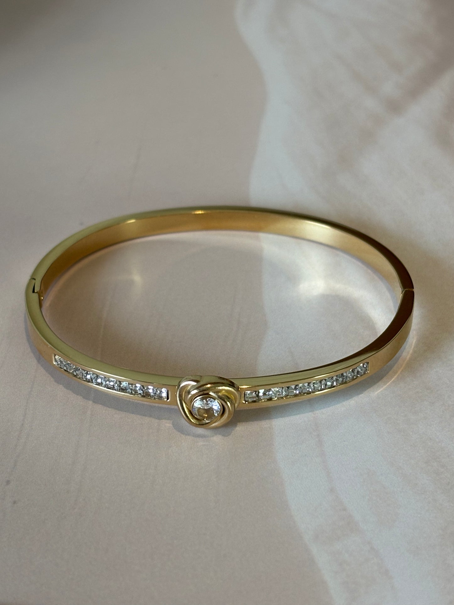 Golden white heart shape bracelet.