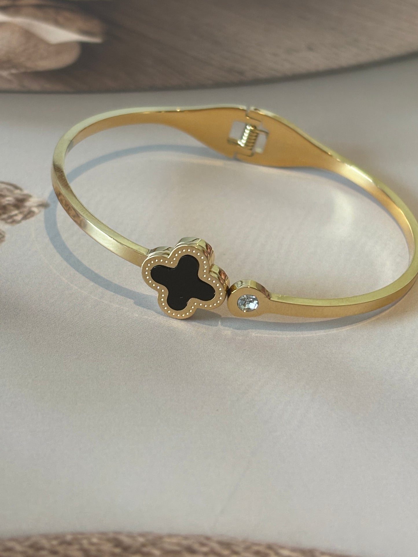 Golden clover leaf bracelet ,black