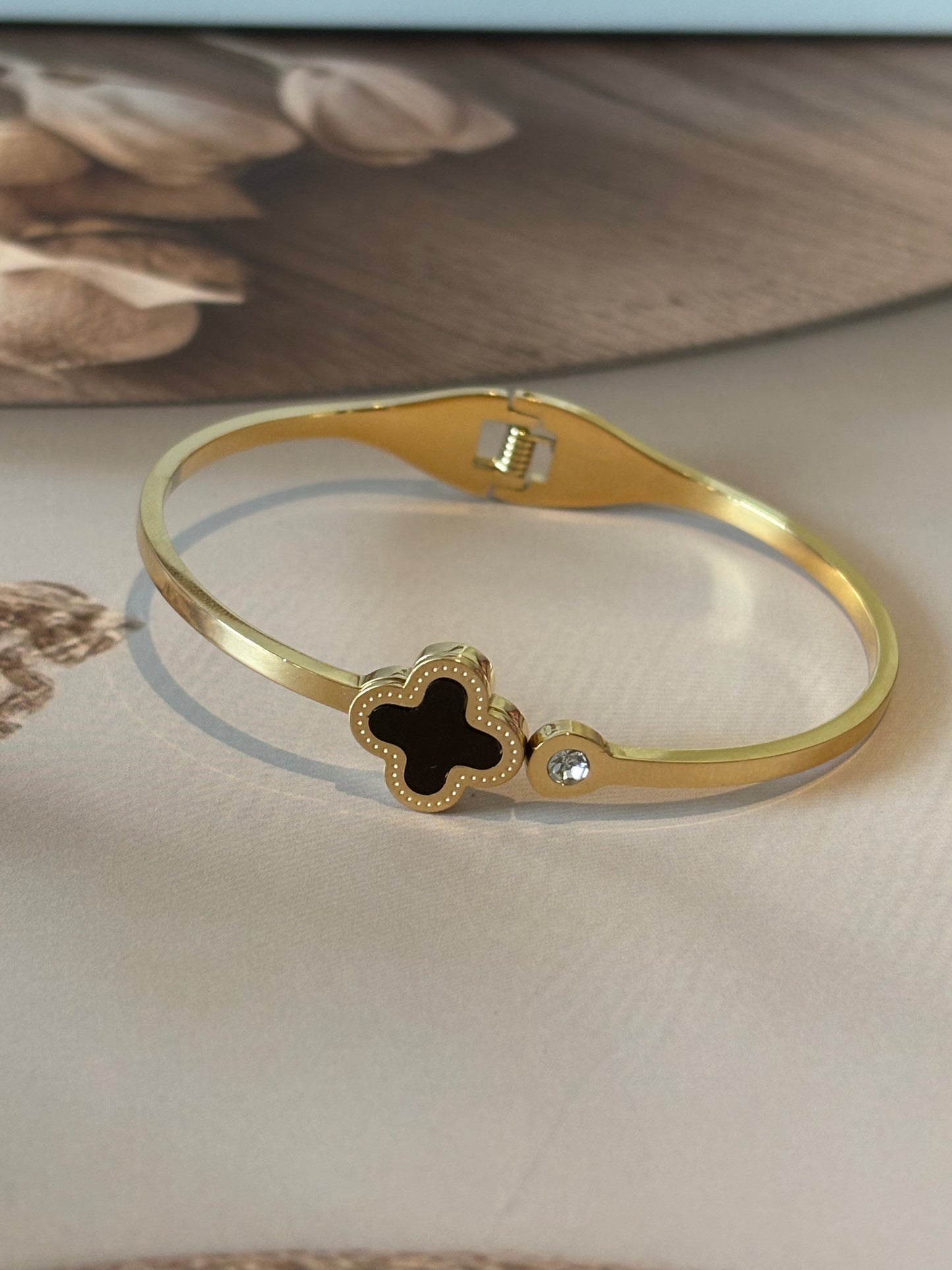 Golden clover leaf bracelet ,black