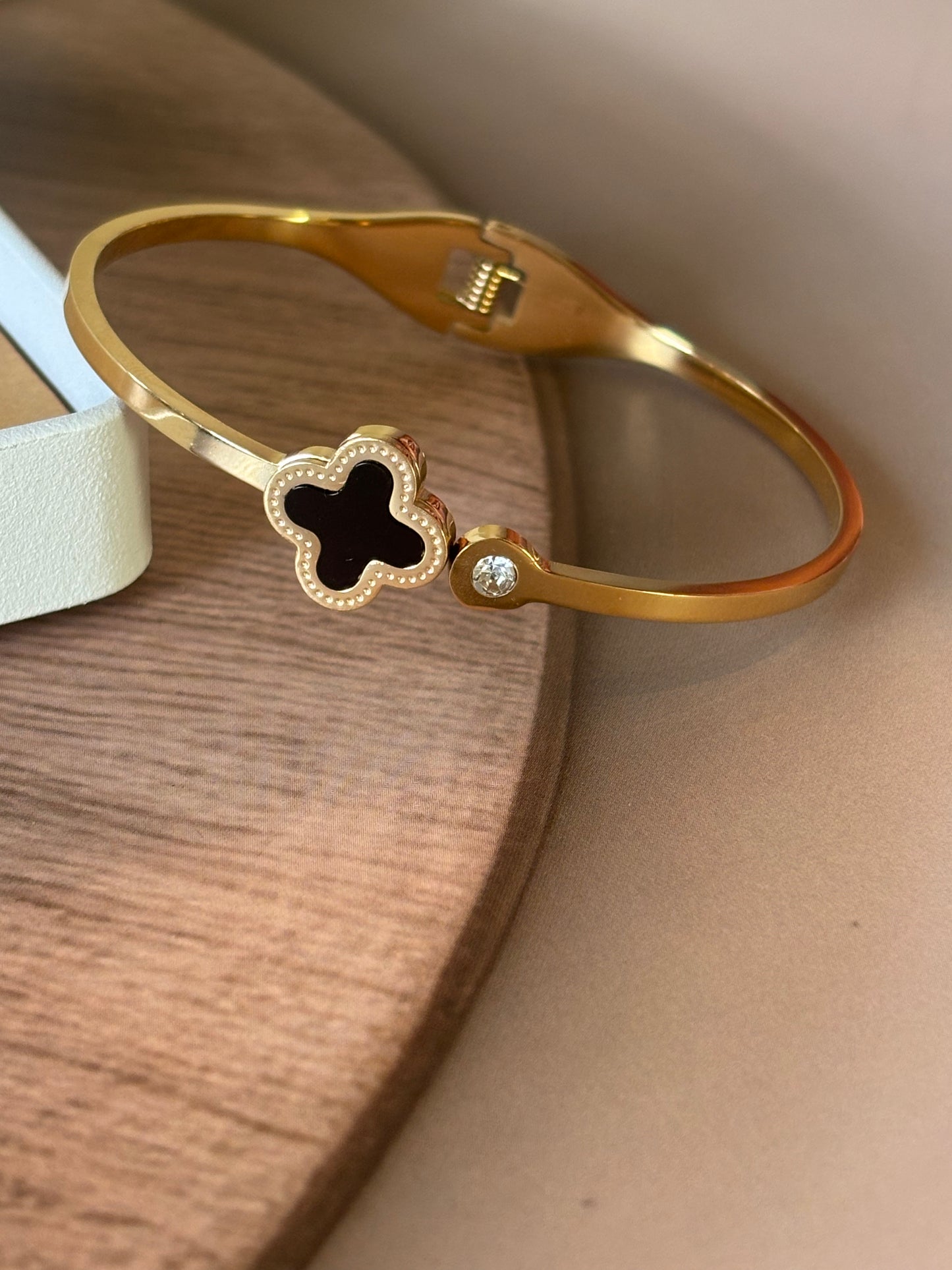 Golden clover leaf bracelet ,black