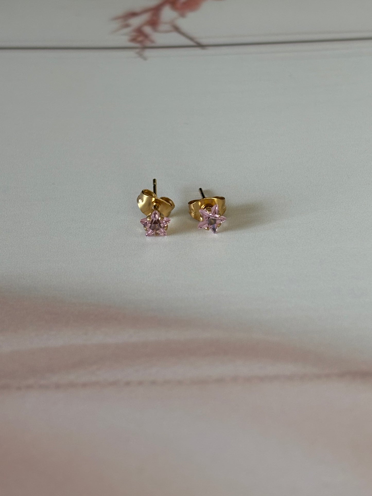 Tiny star studs, baby pink