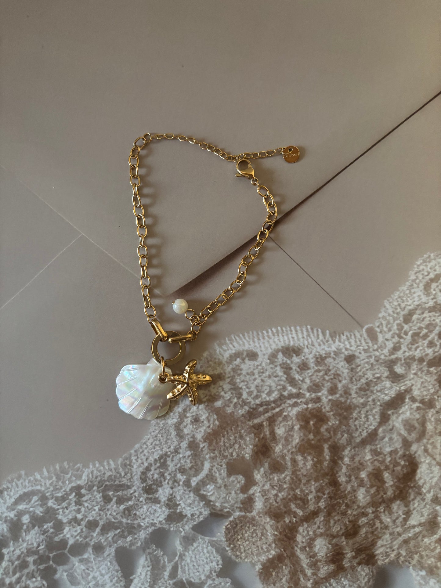 Shell and star motif bracelet