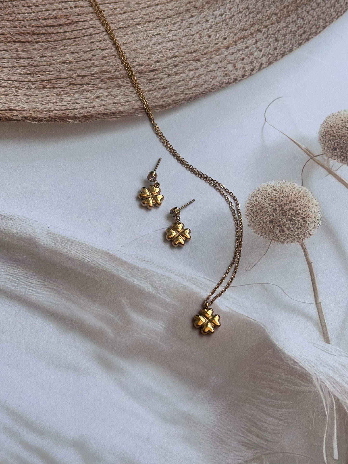 Golden flower with dangling earring chain pendant set