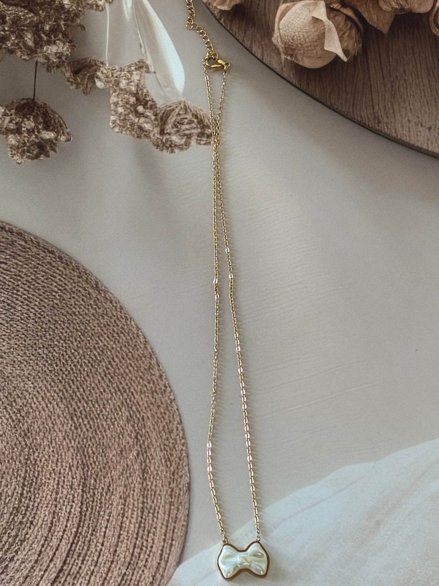 White bow me necklace
