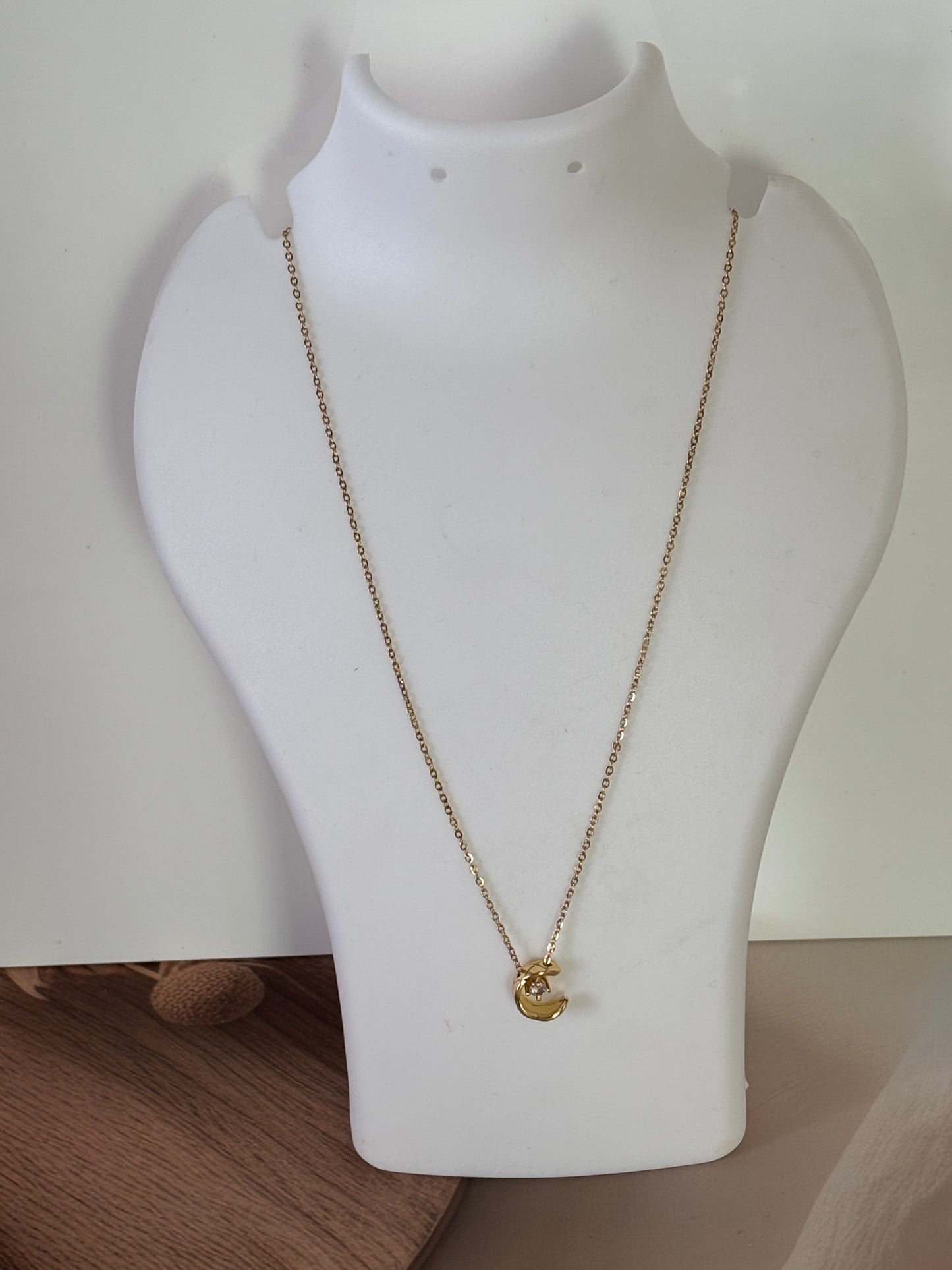 Golden half moon pendant necklace