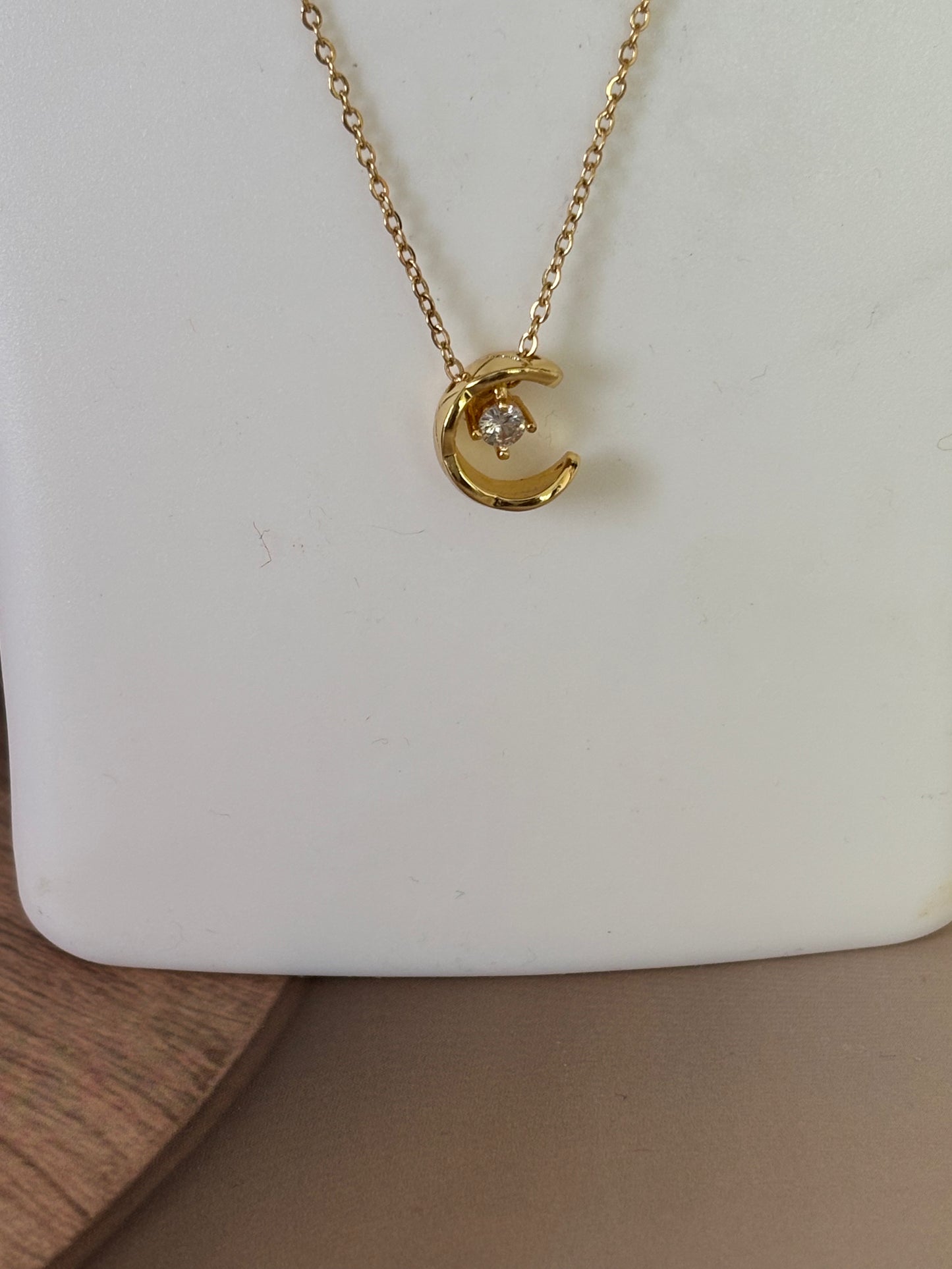 Golden half moon pendant necklace