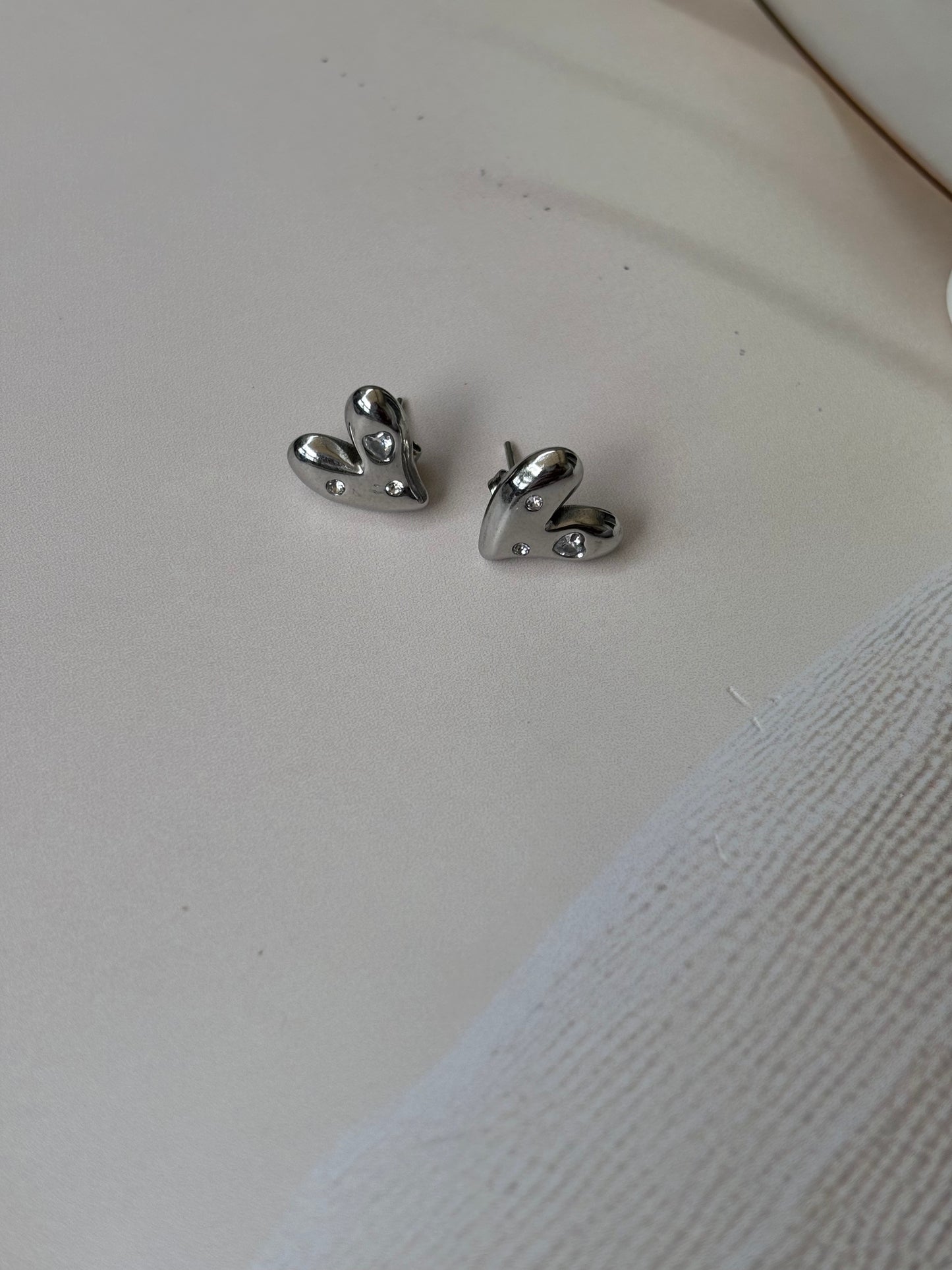 Silver plated heart shape studs with AD