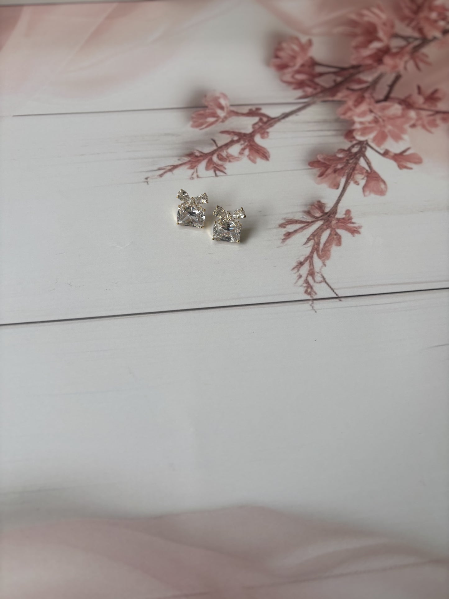 Golden bow gift studs