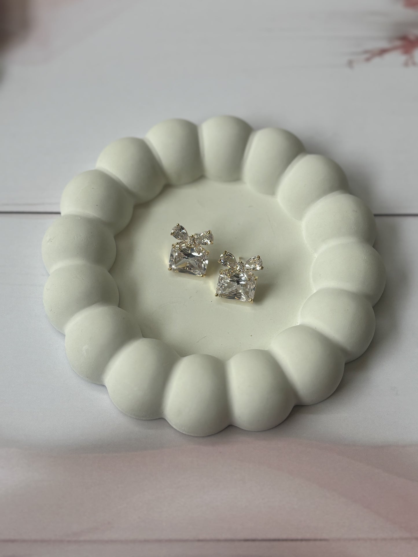Golden bow gift studs