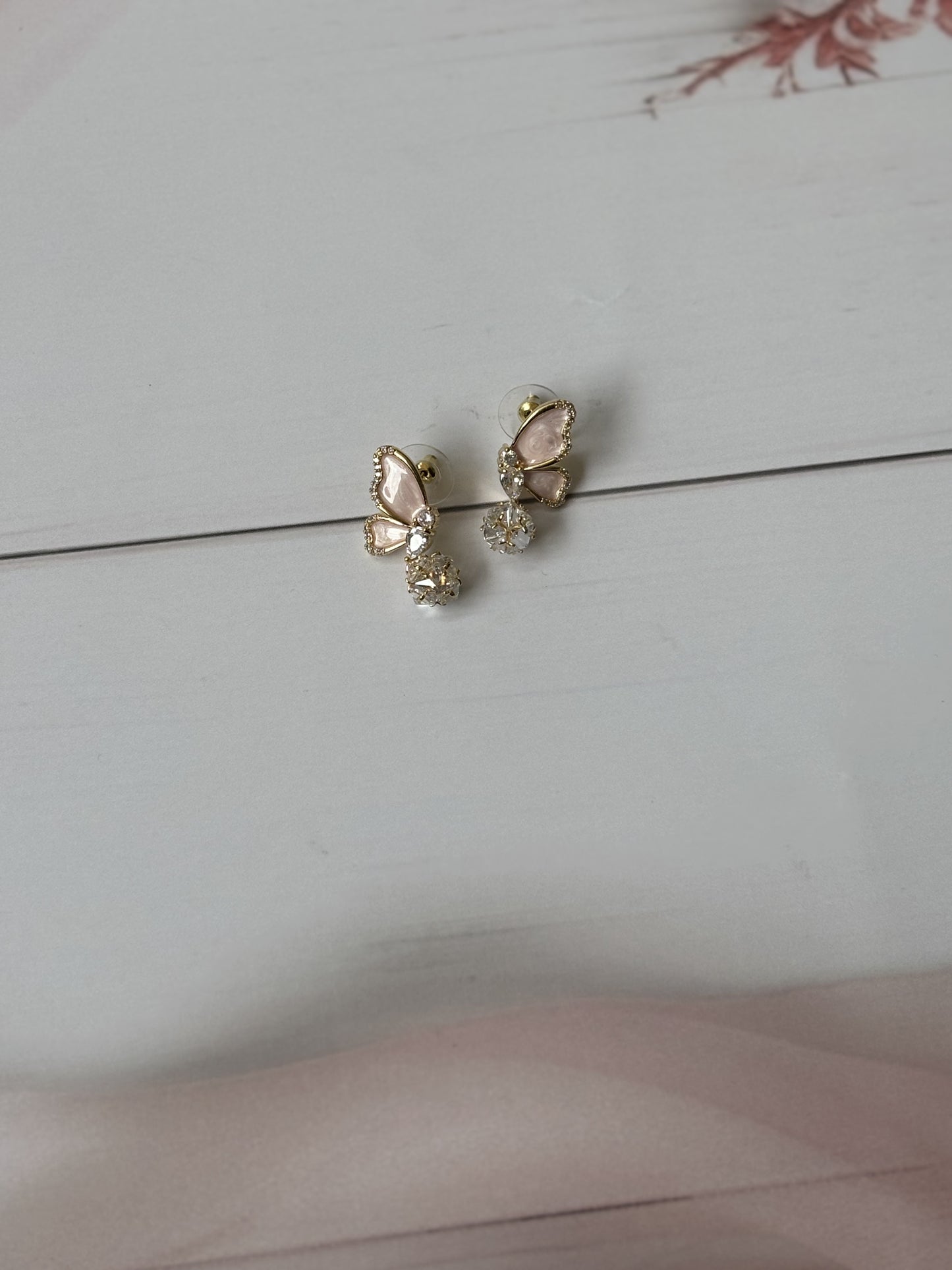 Pink half butterfly dangler earrings