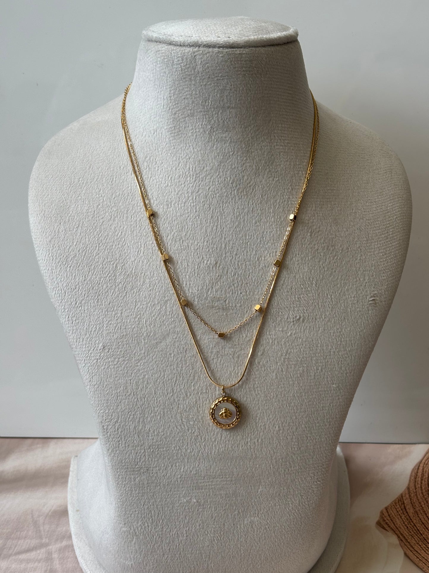 Layered chain with round beetal pendant necklace