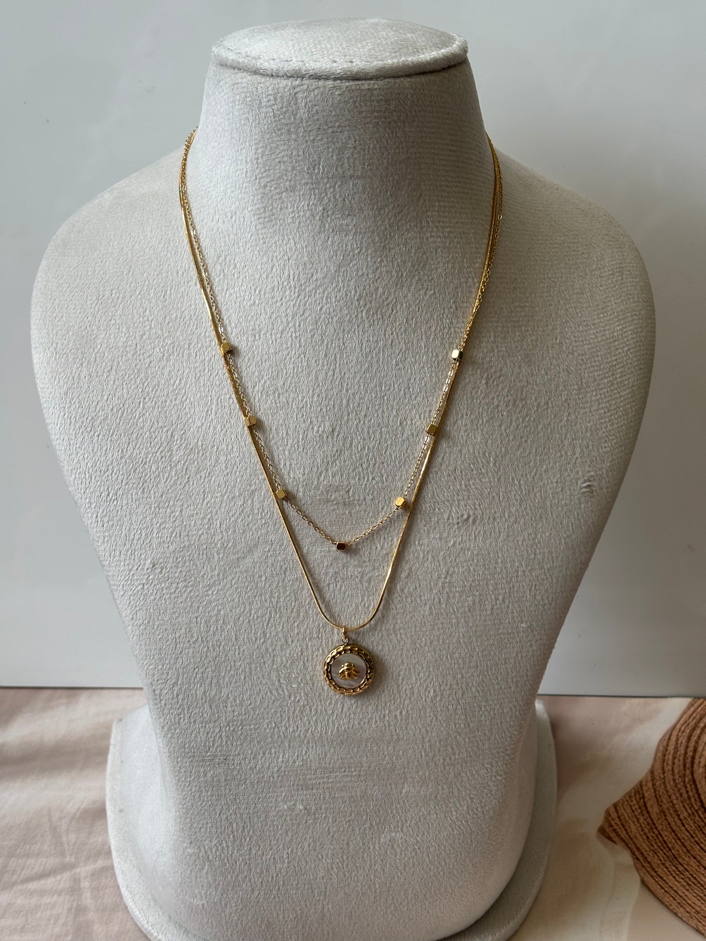 Layered chain with round beetal pendant necklace