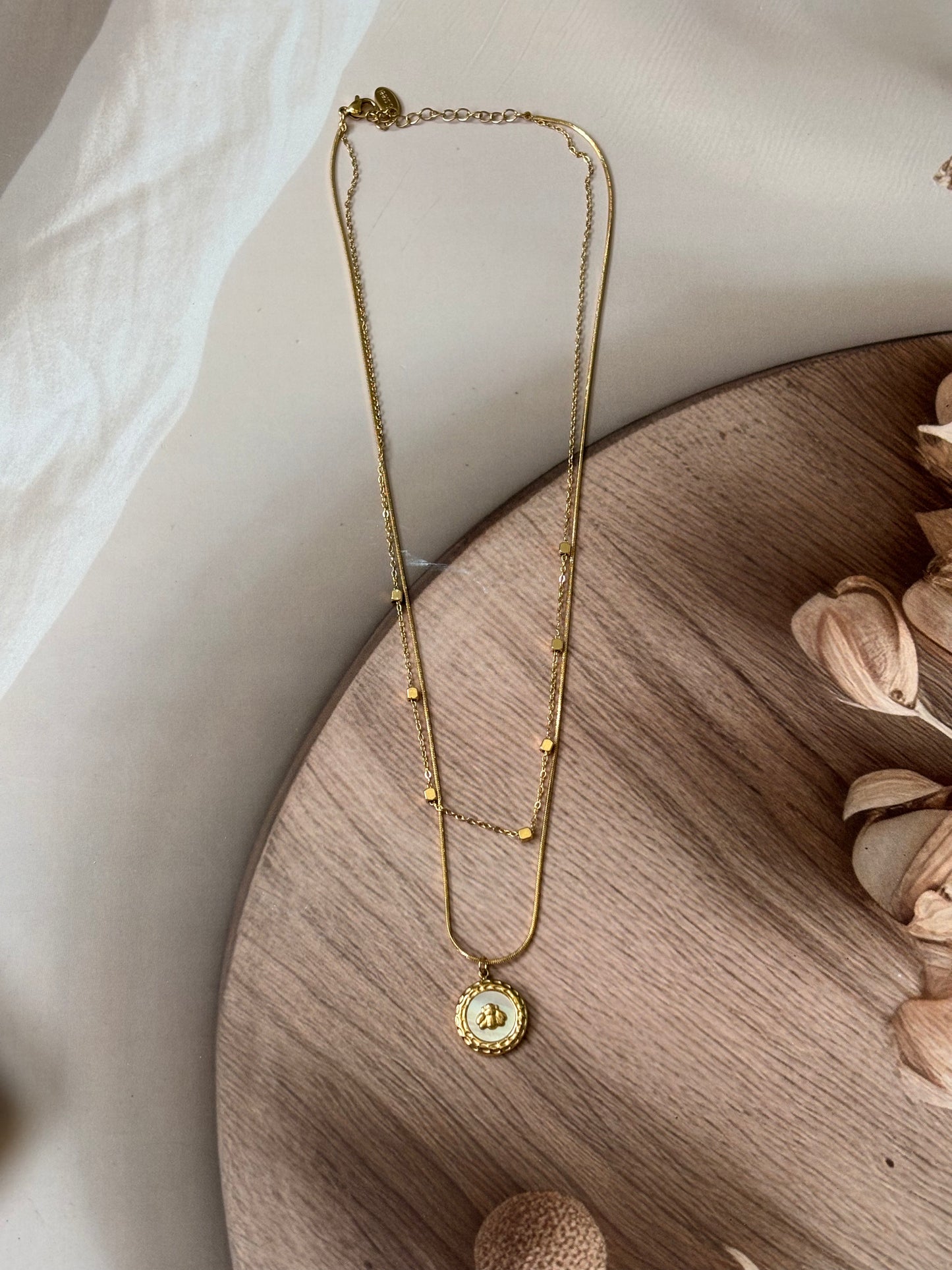 Layered chain with round beetal pendant necklace