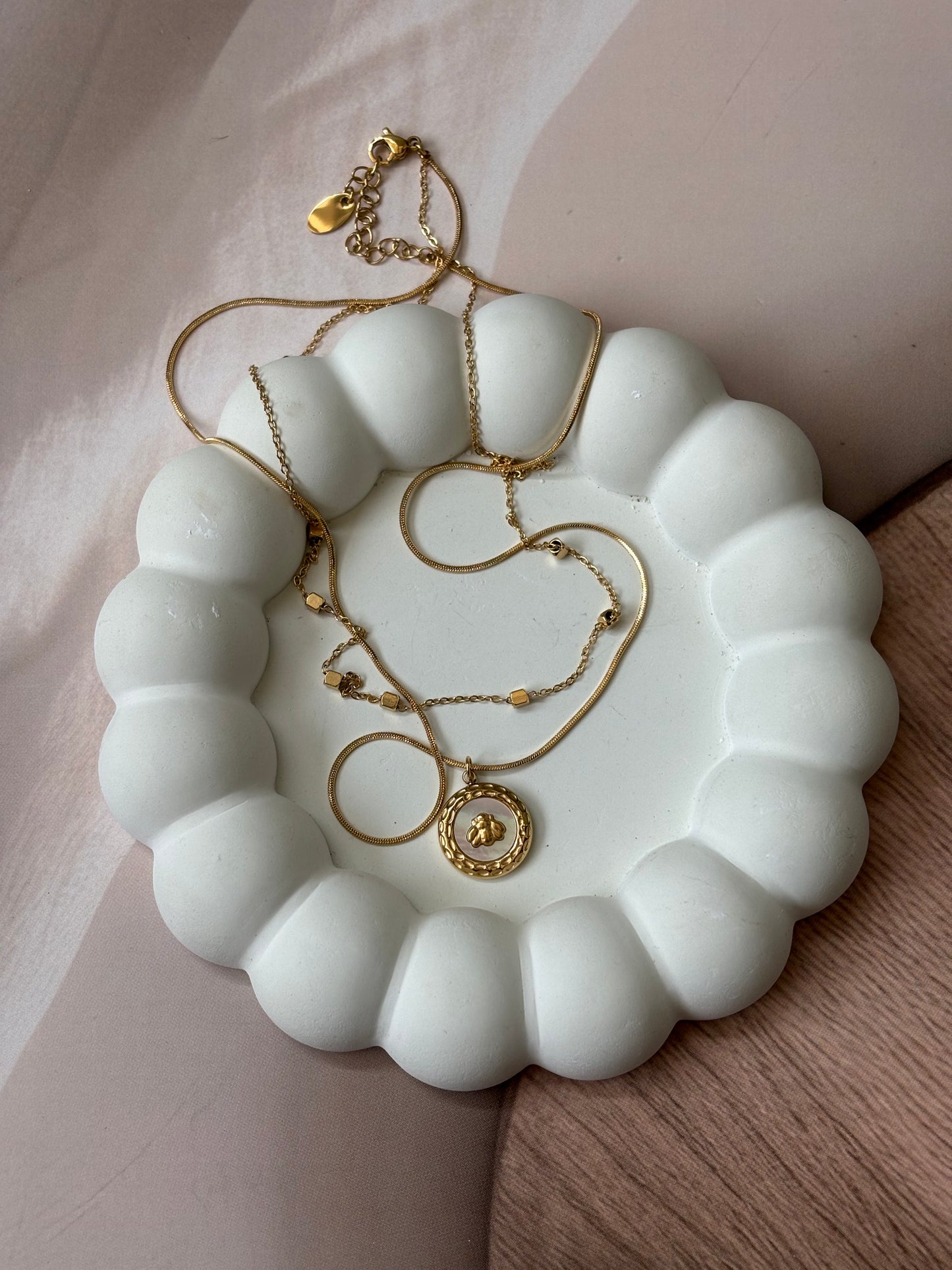 Layered chain with round beetal pendant necklace