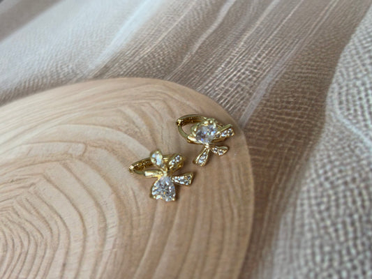 Bow huggie earrings
