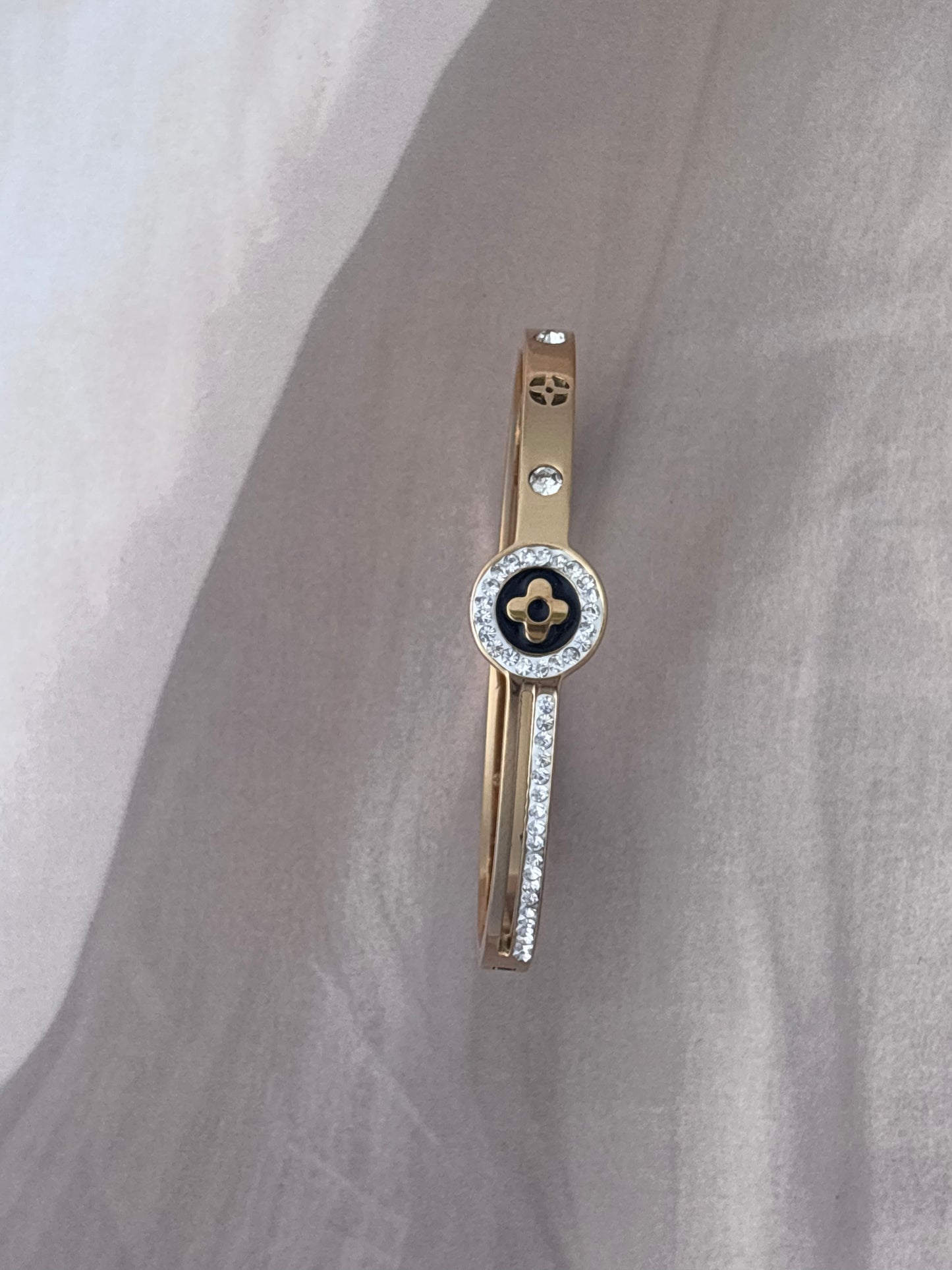 Black motif studded golden kada