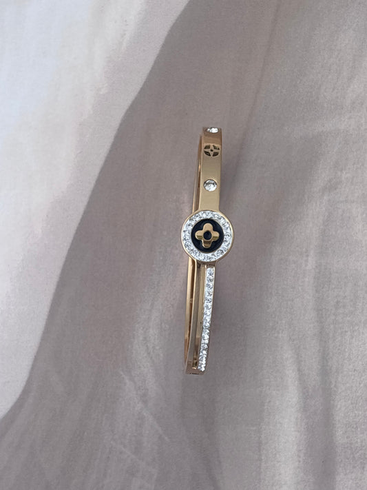 Black motif studded golden kada