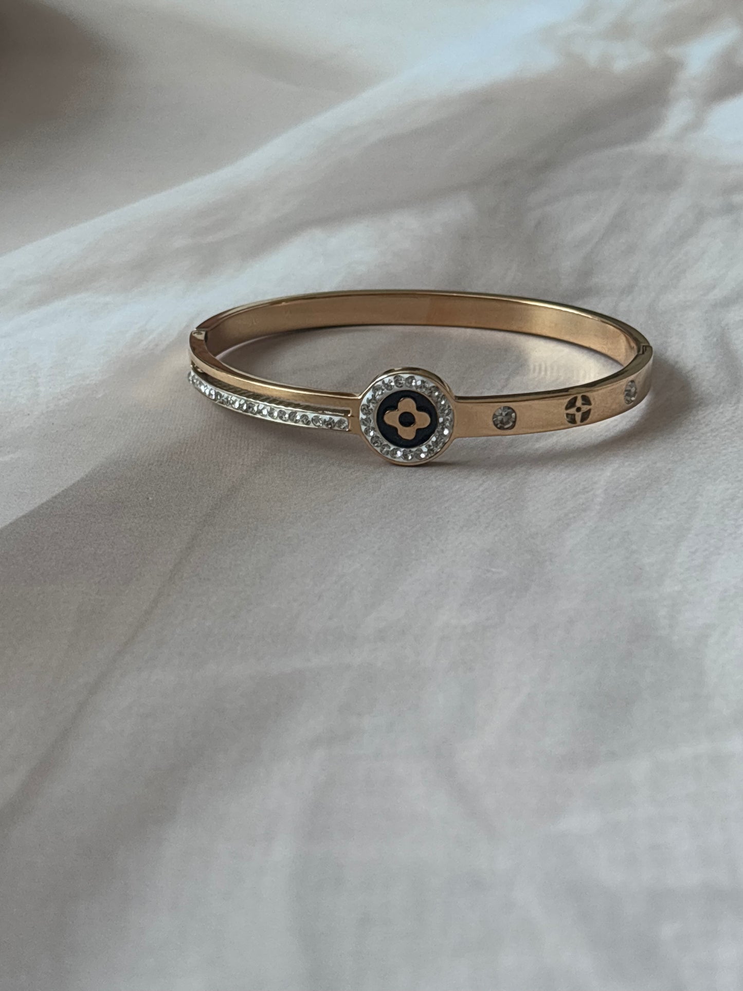 Black motif studded golden kada