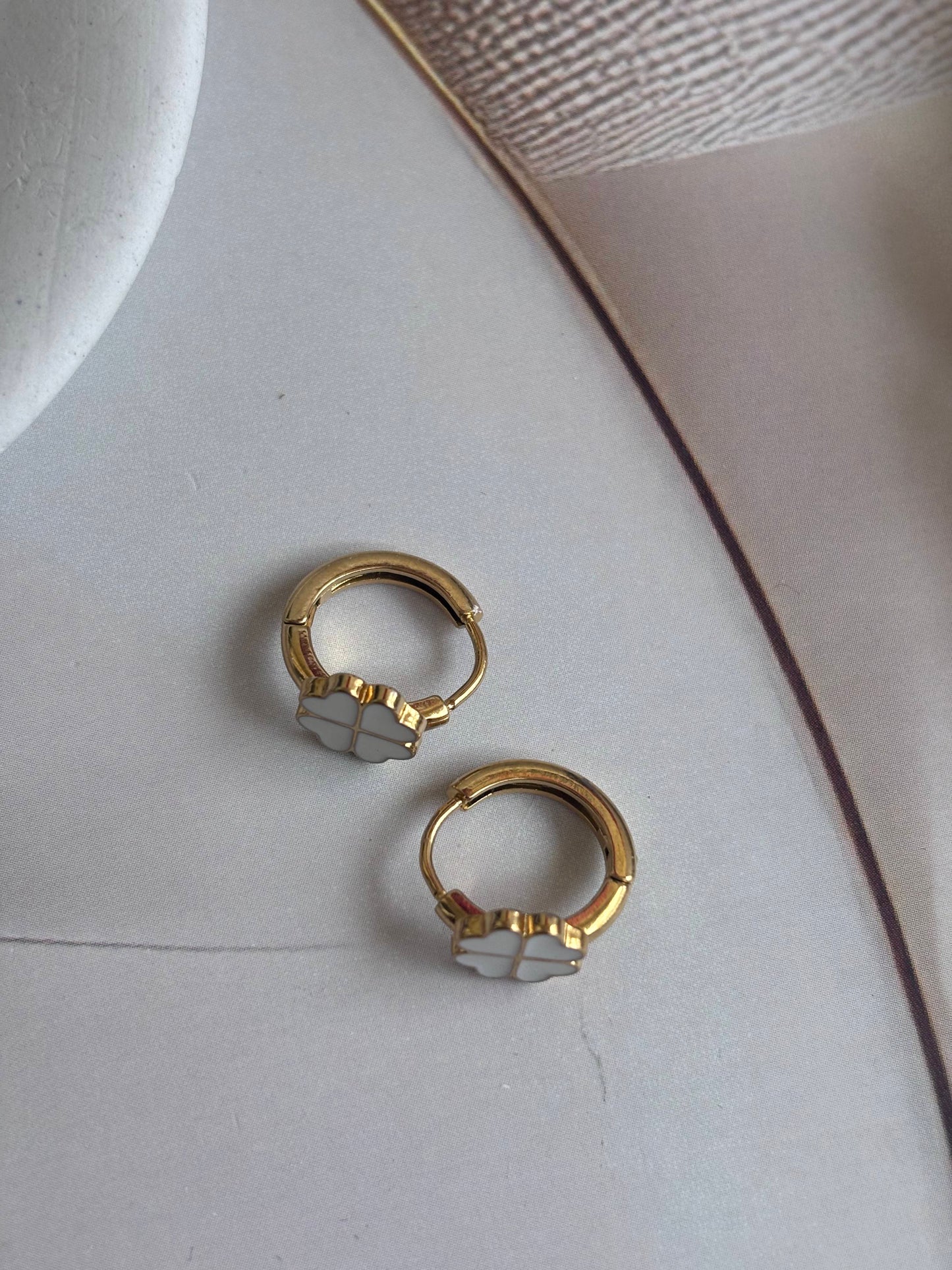 Clovery White Huggie Earrings