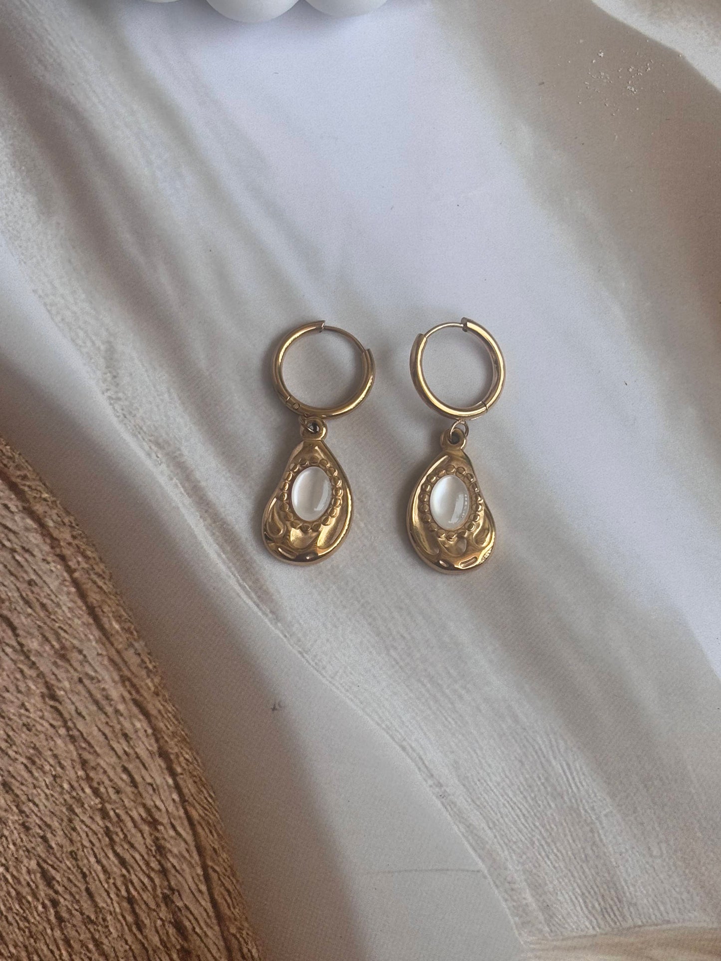 Golden white drop huggie dangler