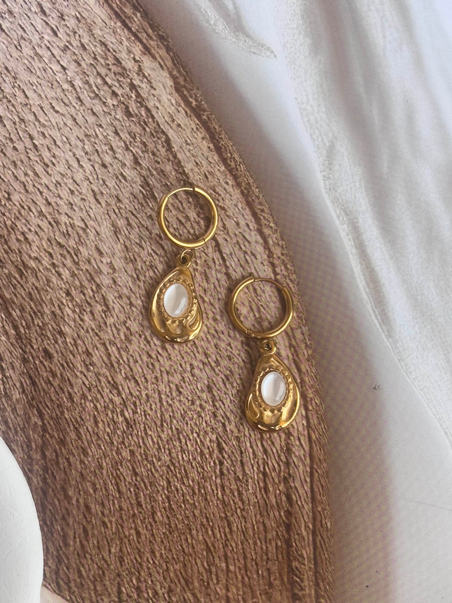 Golden white drop huggie dangler