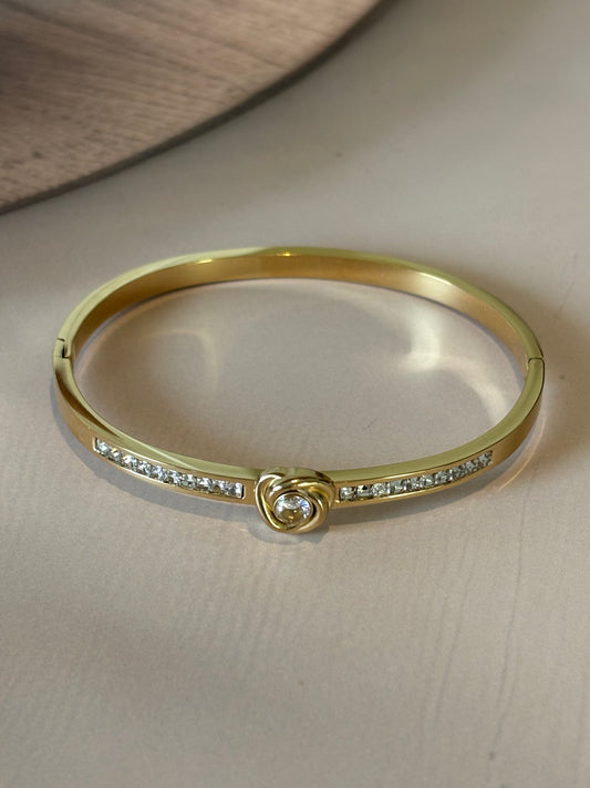 Golden white heart shape bracelet.