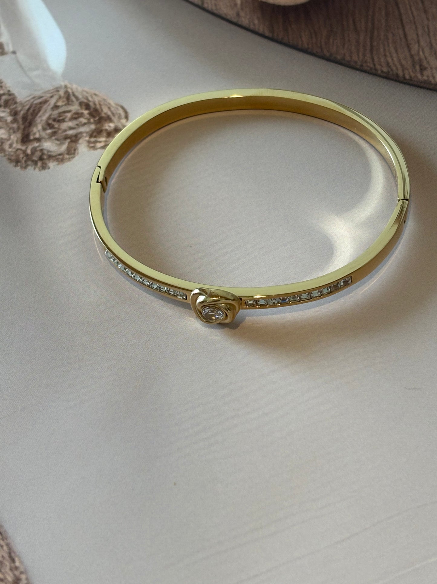 Golden white heart shape bracelet.