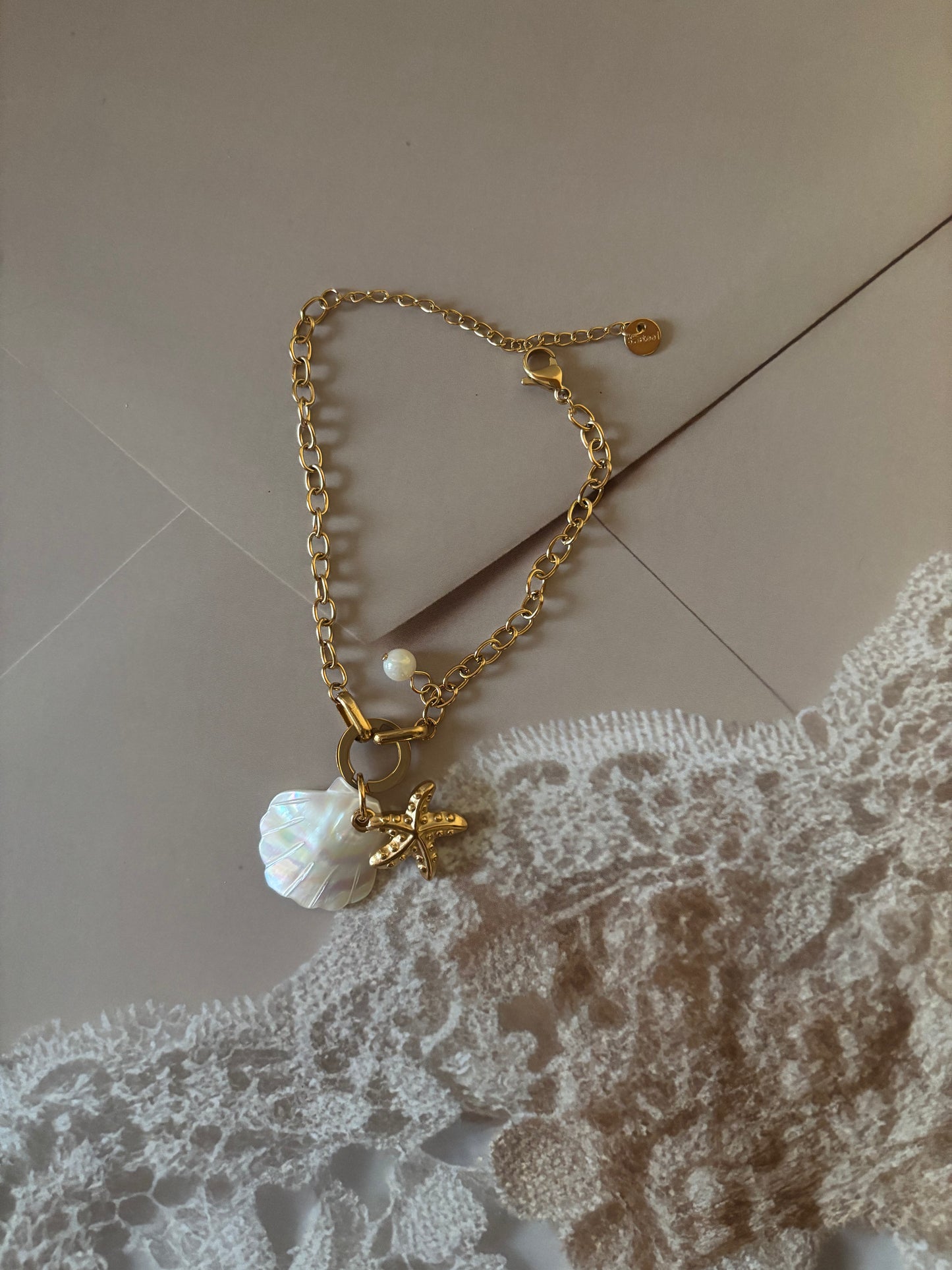 Shell and star motif bracelet