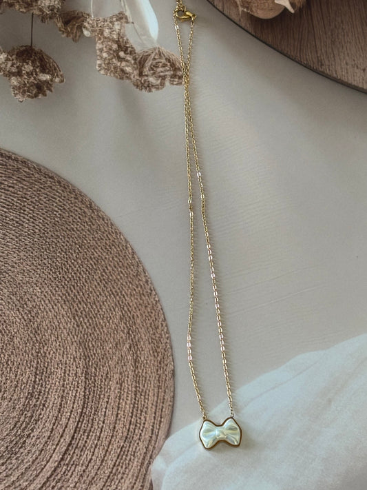 White bow me necklace
